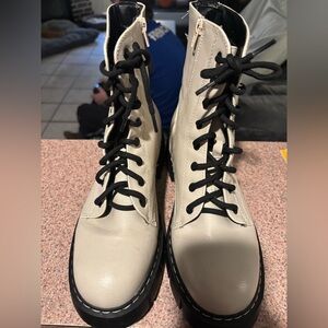 Cream colored combat boots with zipper